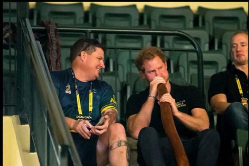 Prince Harry plays the didgeridoo