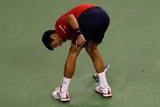 Novak Djokovic smashes a racket while playing against Roberto Bautista Agut