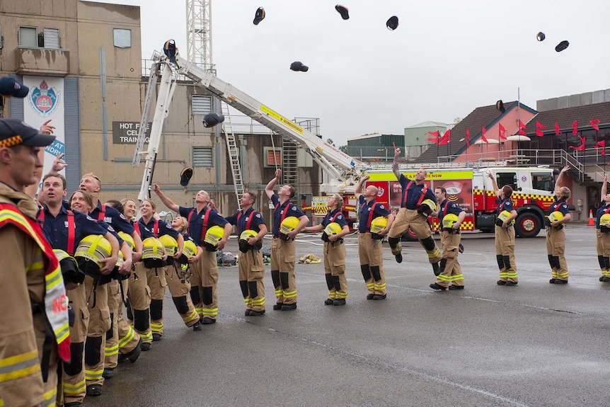 The 2016 FRNSW graduates celebrate with hats in the air