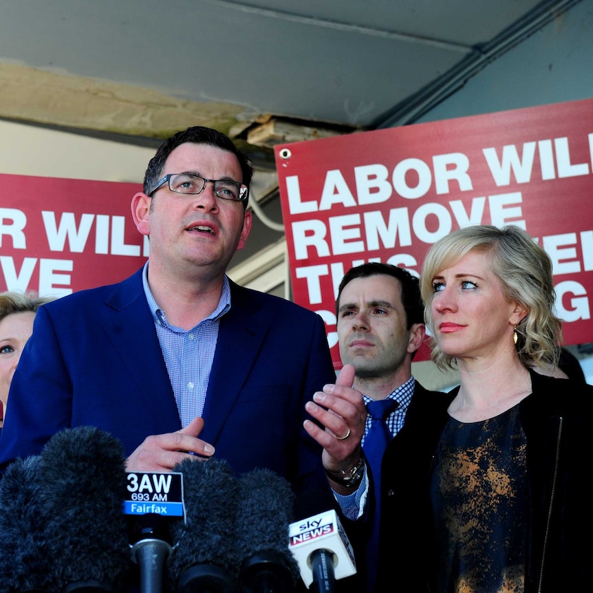 Opposition leader Daniel Andrews and his wife Catherine Andrews (right) speak to media in the 2014 election campaign.