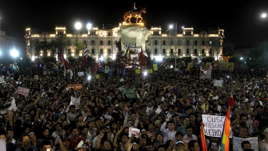 Thousands of protests standing in downtown Lima.