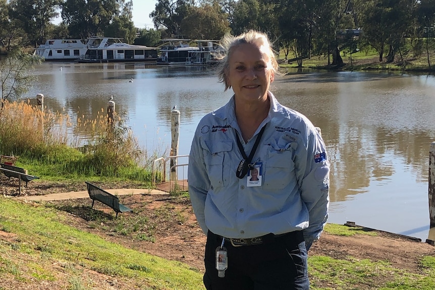 Nurse standing by the Murray river