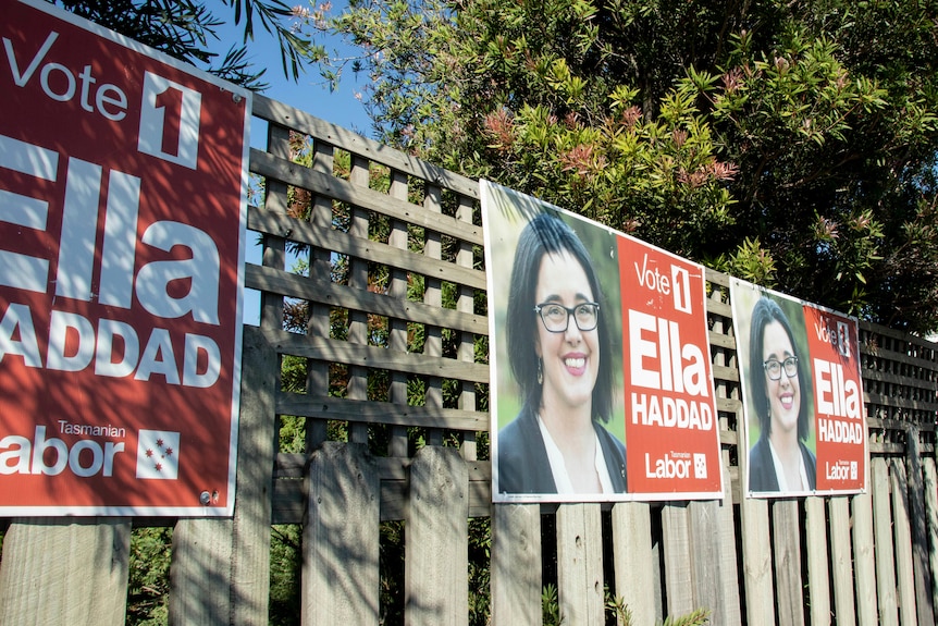 Election posters on a fence