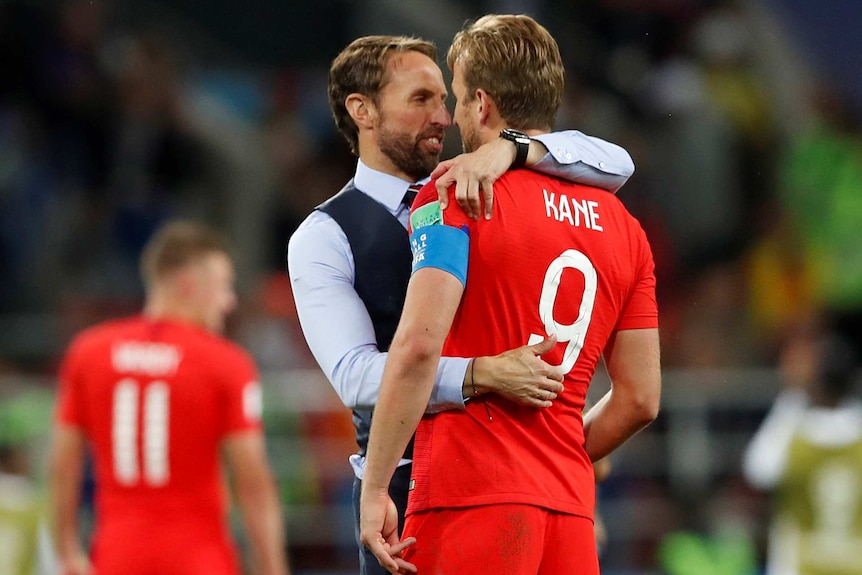 Gareth Southgate hugs Harry Kane at the World Cup after England beat Colombia.