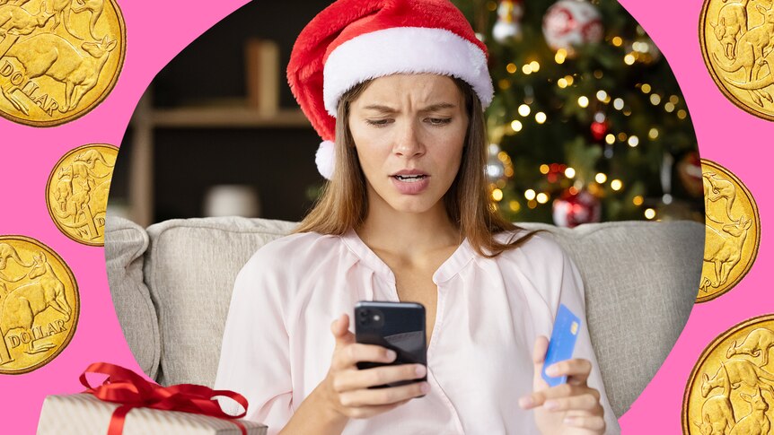 A woman holds a phone while wearing a Christmas hat, for a story about Christmas scams.