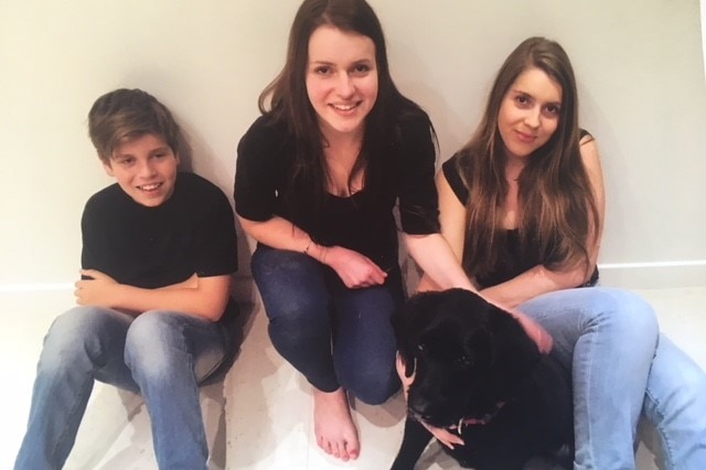 Kerryn Baird's children Luke, Laura and Cate with their dog