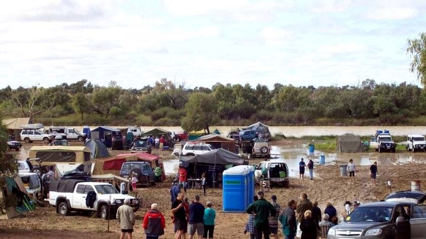 Water resulting from heavy rain covers the camping ground in Birdsville.