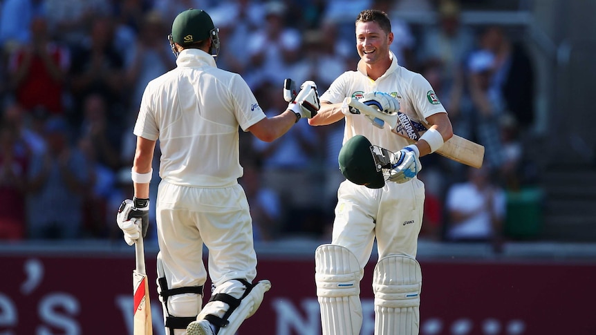 Australian captain Michael Clarke (R) celebrates his century against England at Old Trafford.