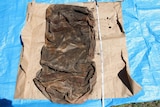 A car seat cover found in a septic tank