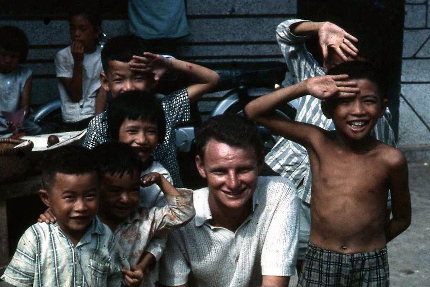 Vietnamese kids and Australian soldier play