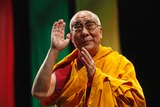 The Dalai Lama addresses a crowd.
