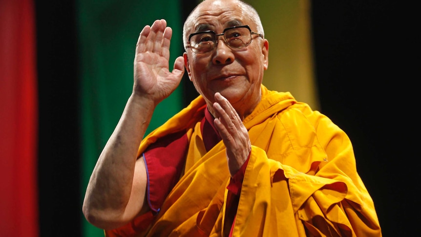 Dalai Lama greets an audience in Mexico City