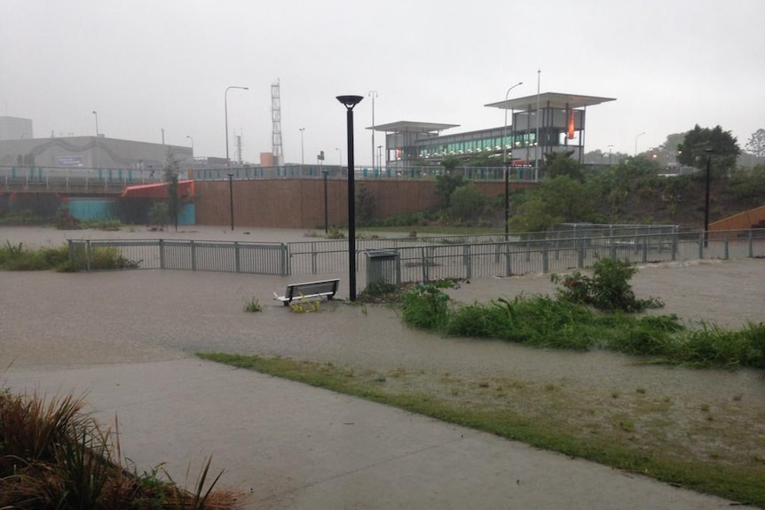 Kedron Brook is rising steadily, swamping the local bus station.