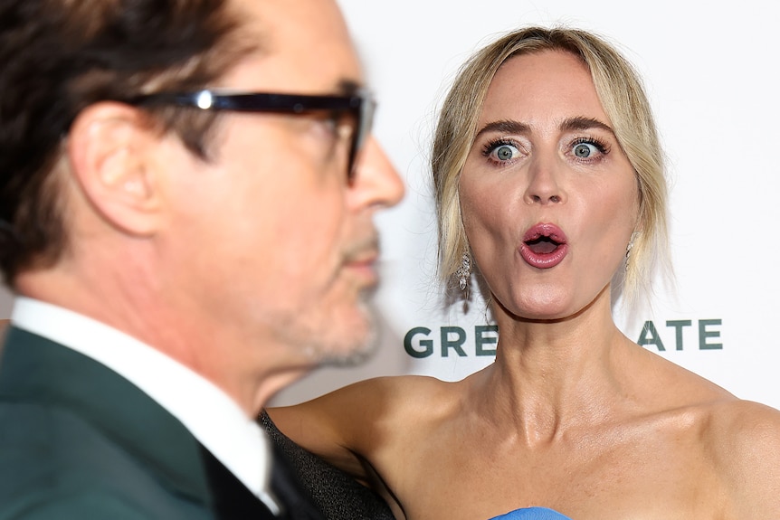 Emily Blunt reacts to Robert Downey Jnr on the red carpet at the PGA awards
