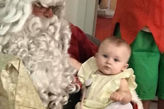 Darcey as a baby on Santa's lap.