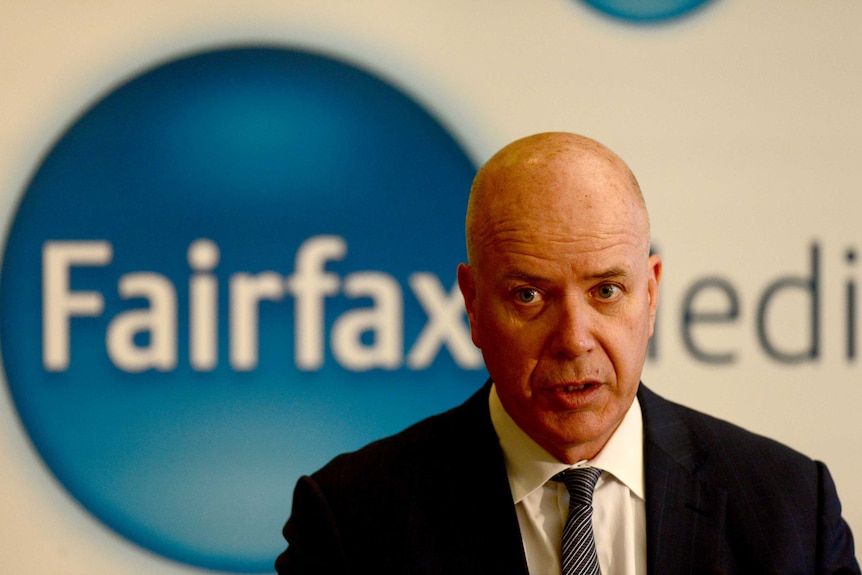 Greg Hywood beside the Fairfax media sign