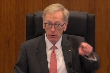 Commissioner Kenneth Hayne points a finger at NAB counsel Neil Young QC during a hearing on August 8, 2017.