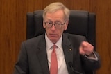 Commissioner Kenneth Hayne points a finger at NAB counsel Neil Young QC during a hearing on August 8, 2017.