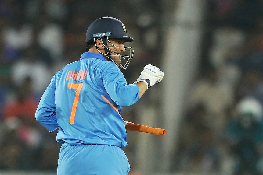 Indian batsman Mahendra Singh Dhoni celebrates between runs.