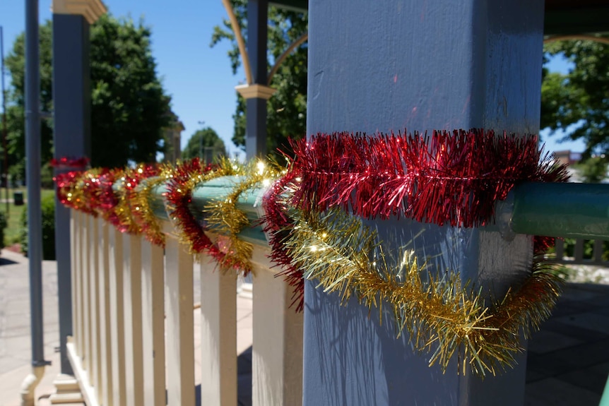Colac Otway Shire Mayor Jason Schram put up tinsel after a bureaucratic bungle left the town lacking Christmas decorations.