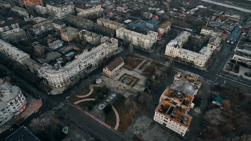An aerial view of Bakhmut shows damaged and smouldering buildings.
