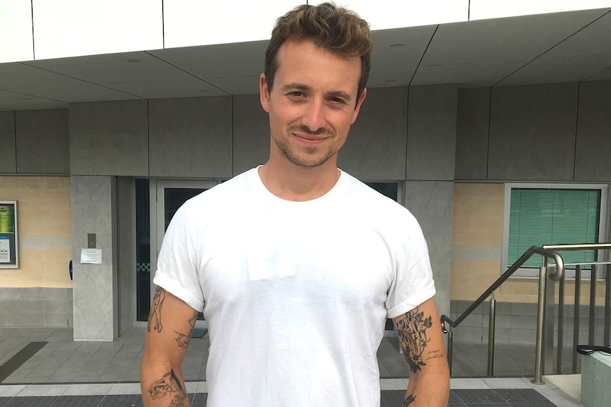 A French journalist outside a north Queensland police station