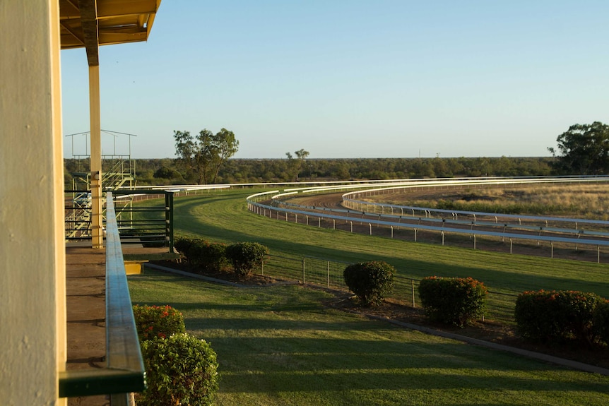 Newly laid lawn on what was once a dirt horse racing track in Barcaldine at dawn