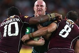 Michael Weyman of the Blues is tackled high by Petero Civoniceva and Matthew Scott.