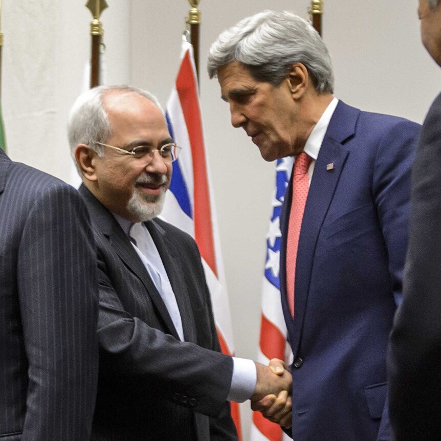 Iranian foreign minister Mohammad Javad Zarif shakes hands with US secretary of state John Kerry in Geneva.