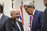 Iranian foreign minister Mohammad Javad Zarif shakes hands with US secretary of state John Kerry