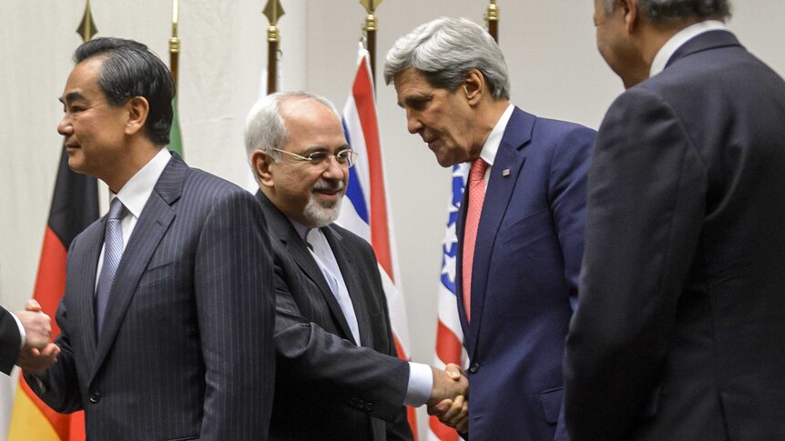 Iranian foreign minister Mohammad Javad Zarif shakes hands with US secretary of state John Kerry
