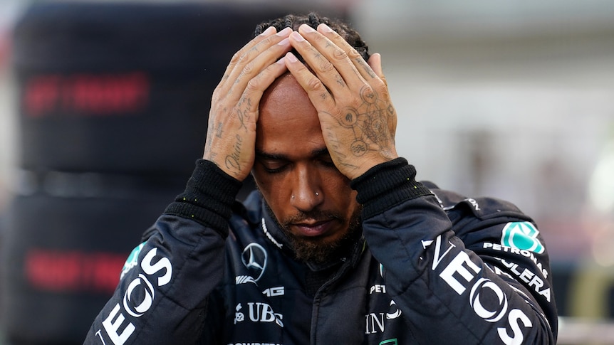 Lewis Hamilton holds his head before the Bahrain Gramd Prix