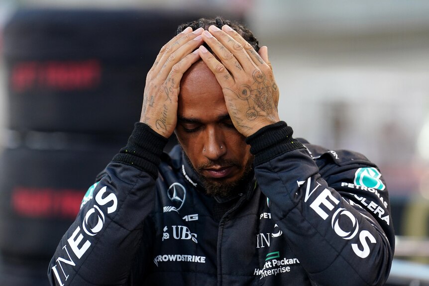 Lewis Hamilton holds his head before the Bahrain Gramd Prix