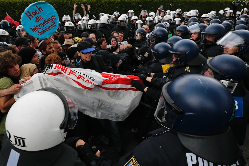 Protesters clash with police at G7 summit