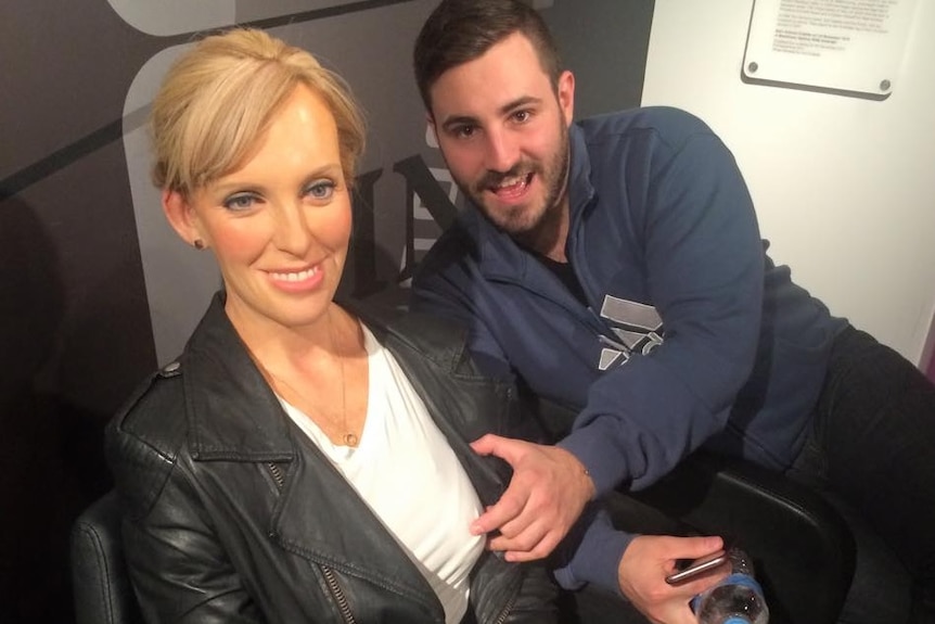 Rhys Adams touches a waxwork of Toni Collette.