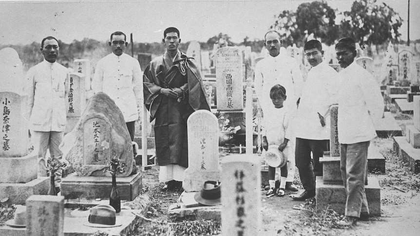 On the even of annual Bon Matsuri festival, Yasukichi Murakami with son and Japanese men at Broome cemetery
