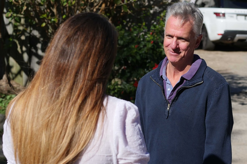 Car donor Maris Taylor talks with DV survivor Rachael*.