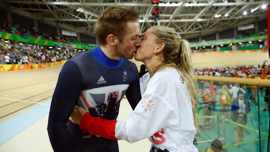 Laura Trott and Jason Kenny kiss at the Rio Olympic Velodrome.