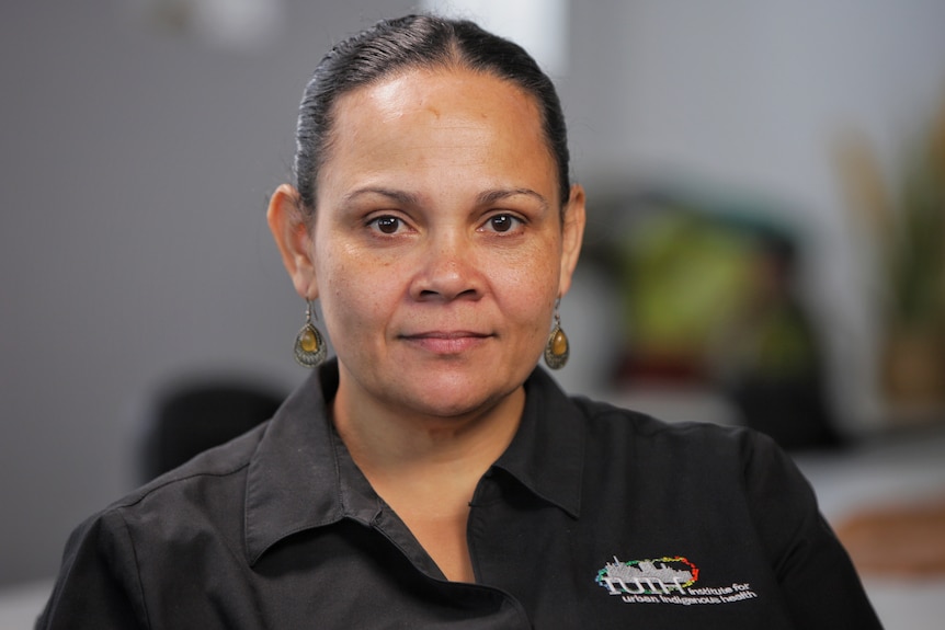 A woman wearing a black shirt.