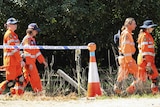 SES and Police walk to the search area for Daniel Morcombe