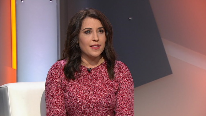 Annika Smethurst sits on a white couch for the television program Insiders.