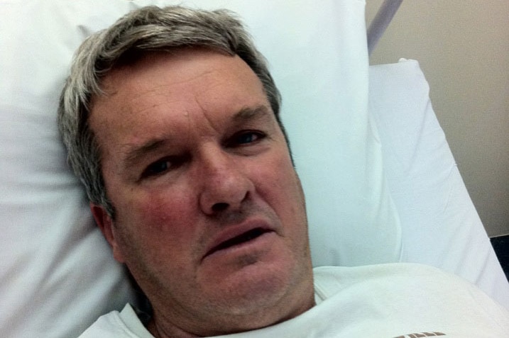 Birdsville Senior Constable Neale McShane recovering in hospital from a potentially fatal stroke in May 2015.
