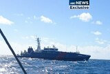 Australian Customs boat approaches an asylum seeker boat