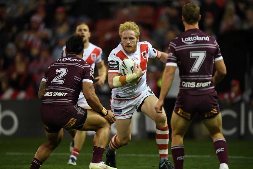 James Graham of the Dragons runs with the ball against Manly.