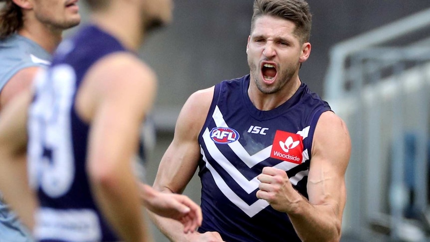 Jessie Hogan celebrates kicking a goal at Perth Stadium