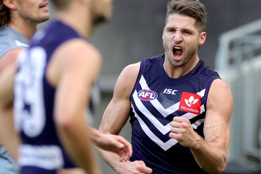 Jessie Hogan celebrates kicking a goal at Perth Stadium