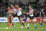 NRL players run to their teammate who has won the game.