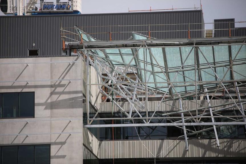 A close-up shot of a mangled second storey glass roof after it collapsed at Perth's Curtin University.