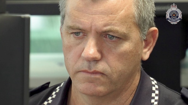 close up of man's face in police shirt