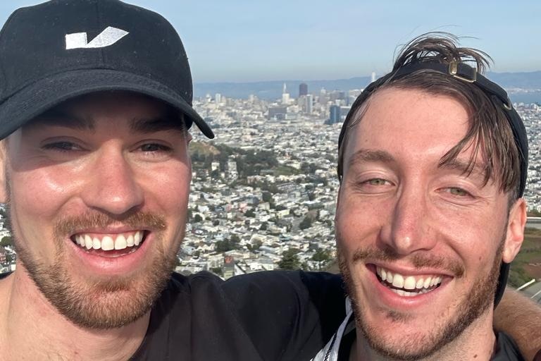 two boys with a california skyline behind them